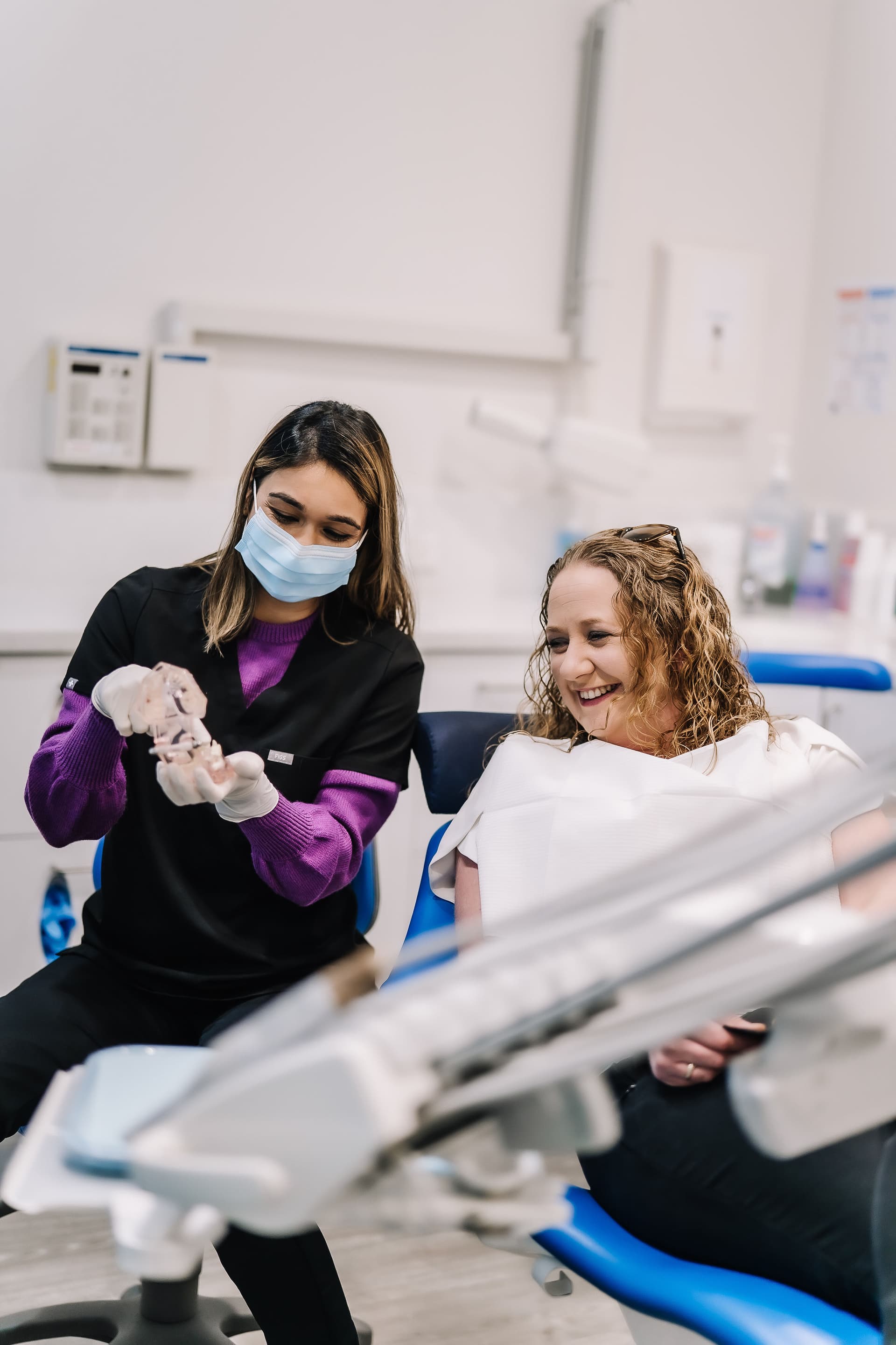 A dentist and patient reviewing imaging results together at Sienna Smiles